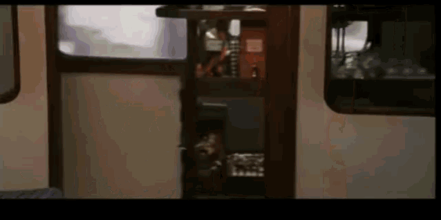 a blurred image of a train with a sign on the door that says ' emergency exit '