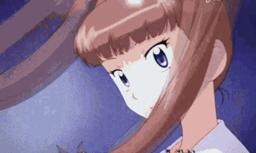 a close up of a girl 's face with a blue eye