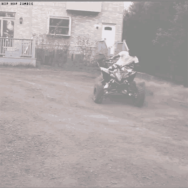 a picture of a person riding a four wheeler with the words hip hop zombie on the bottom