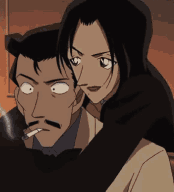 a man is smoking a cigarette while a woman holds him