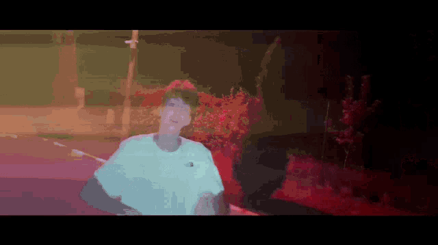 a pixelated image of a man wearing a white shirt that says north face