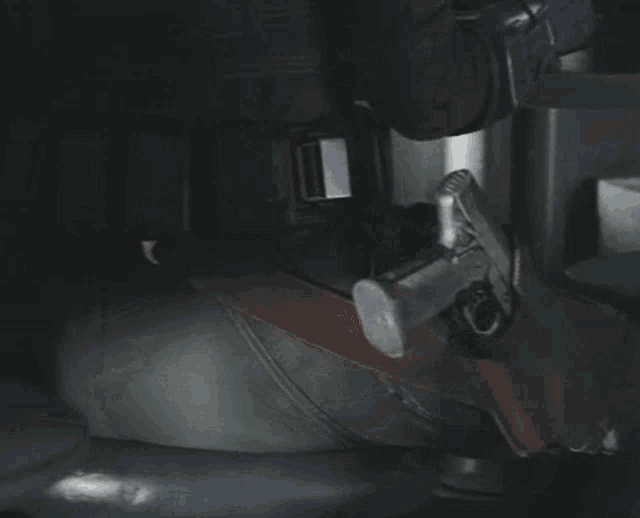 a close up of a person holding a gun in their holster