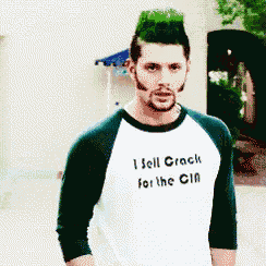a man with green hair is wearing a t-shirt that says i sell crack for the cia