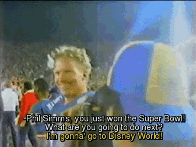 a man in a blue shirt with the word phil on it