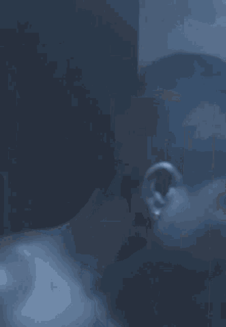 a close up of a man 's face with his mouth open .