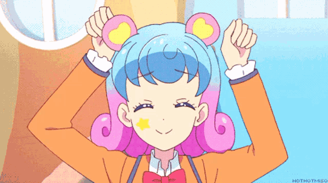 a cartoon girl with blue hair and a yellow star on her cheek
