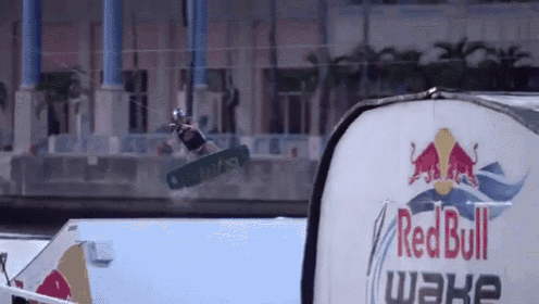 a red bull wake boarder jumps in the air