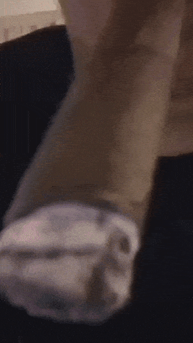 a close up of a person 's hand with a black background
