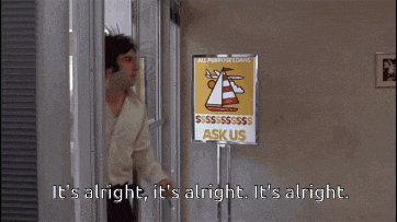 a man says it 's alright in front of a sign that says sk us