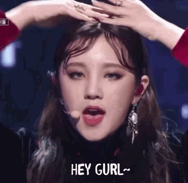 a close up of a woman 's face with the words hey gurl written on it .
