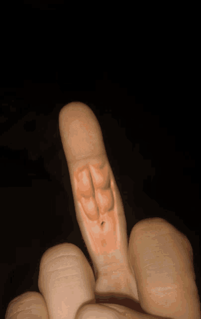a close up of a person 's thumb that looks like a worm