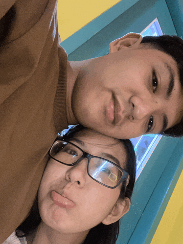 a man and a woman are posing for a picture together