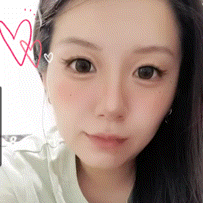 a close up of a woman 's face with a drawing of hearts behind her