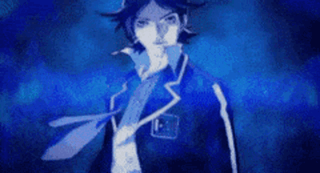 a man in a blue suit and tie is standing in a dark room with a blue background .