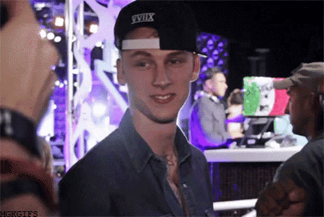 a man wearing a hat that says xviix on it