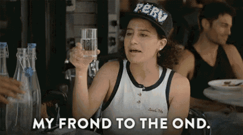 a woman wearing a peru hat is holding a glass of water and saying " my frond to the ond "