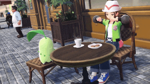 a girl sitting at a table with a green leaf on it