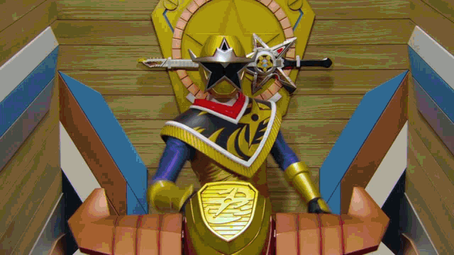 a toy ninja warrior with a shield and sword on his head