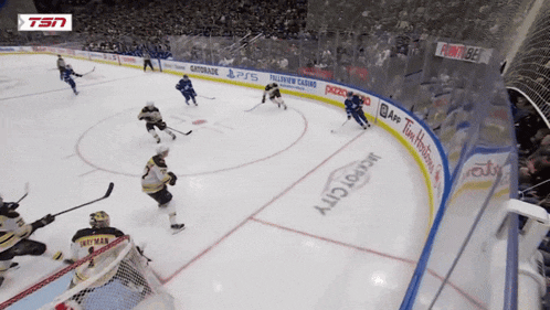 a hockey game is being played in a stadium with advertisements for gatorade and tim hortons on the boards