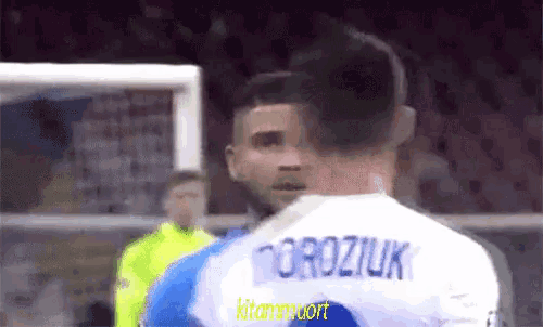 a soccer player with the name roziuk on the back of his shirt