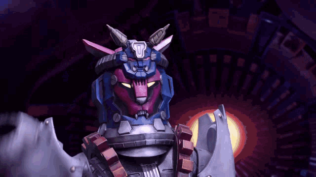 a robot with the letter t on it 's face