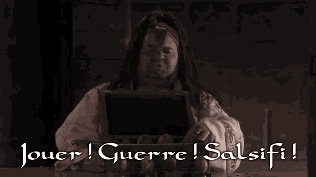 a man is holding a box with the words jouer guerre salsifi written on it