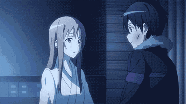 a boy and a girl are looking at each other