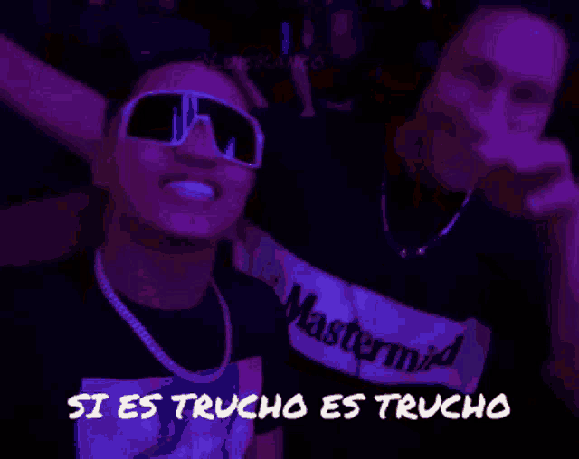two men are posing for a picture with the words si es trucho es trucho