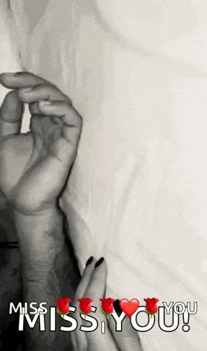a black and white photo of a man and woman holding hands with the words miss you written above them