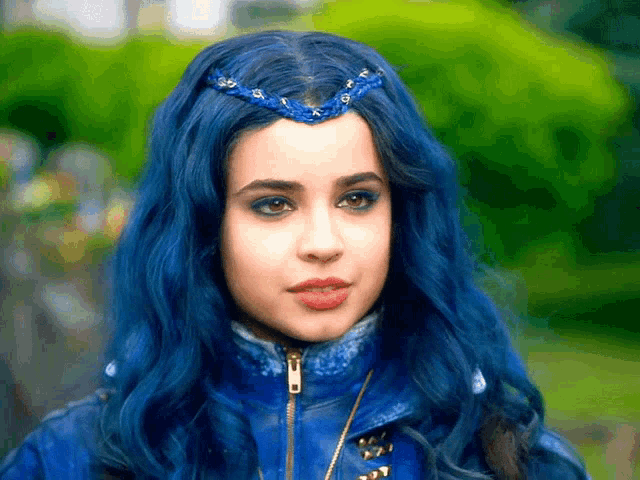 a girl with blue hair and a blue jacket