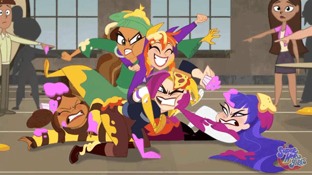 a group of super hero girls laying on the ground