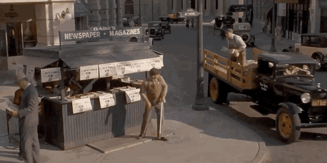 a newspaper stand with a sign that says o'abb 's newspaper magazines