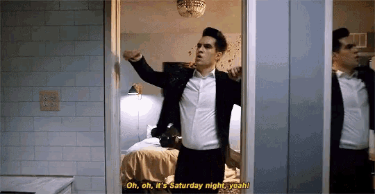 a man in a suit says oh oh it 's saturday night yeah !