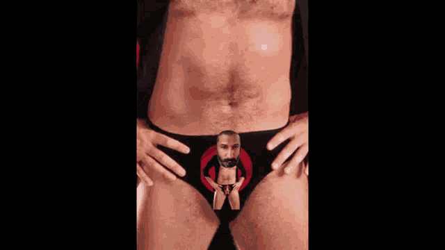 a man 's underwear has a picture of a man with a beard in a red circle