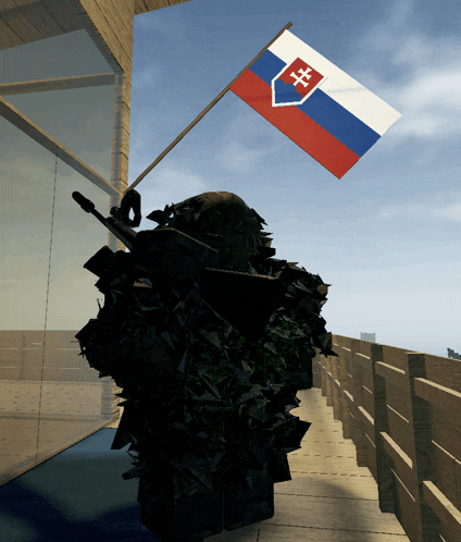 a soldier is holding a flag that has the letters hh on it