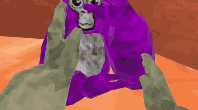 a person is holding a purple stuffed animal with a gray face