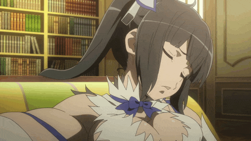 a girl with a ponytail is sleeping on a couch in a library