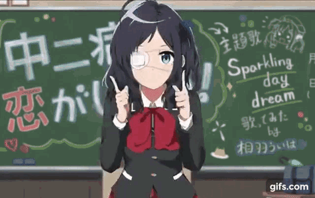 a girl in a school uniform is standing in front of a blackboard .