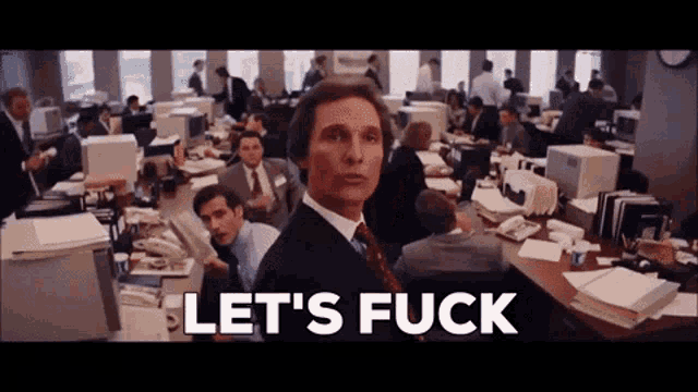 a man in a suit and tie says let 's fuck in front of an office
