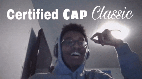 a man wearing a hoodie and headphones with the words certified cap classic behind him