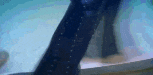 a person wearing a pair of blue polka dot socks is walking down stairs