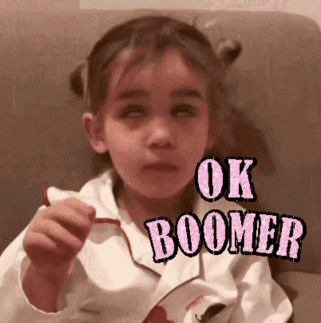 a little girl is wearing a white jacket with ok boomer written on the front