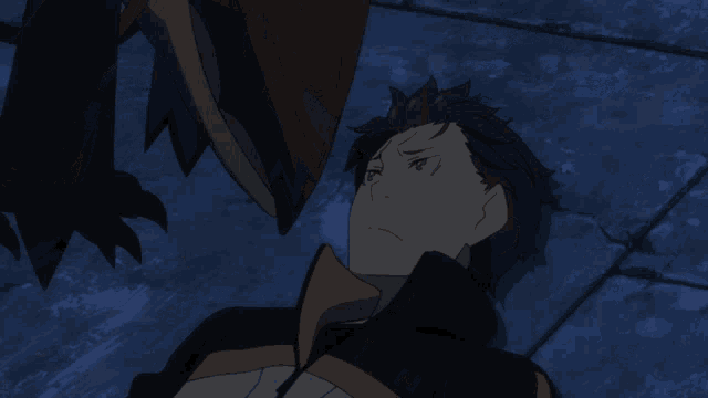 a man laying down with a monster behind him in a dark room