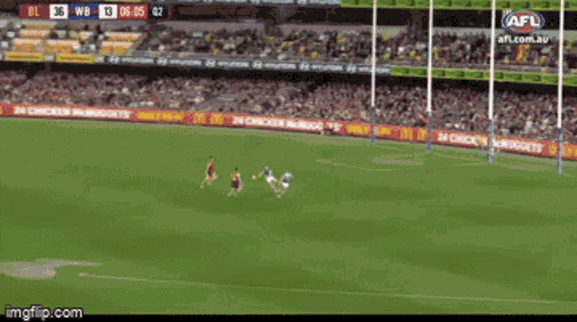 a soccer game is being played on a field with ads for mcdonald 's and chicken nuggets