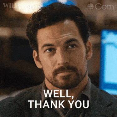a man with a beard and a suit says well thank you