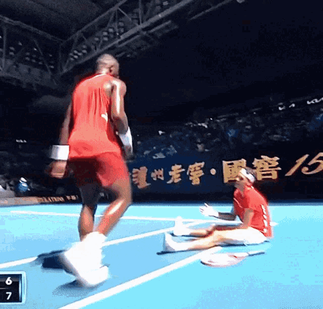 a man in a red shirt is running on a tennis court with a score of 6 to 7