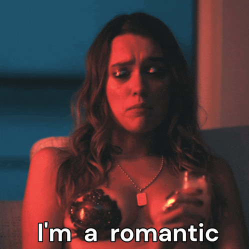 a woman with a necklace on her chest says i 'm a romantic on the bottom