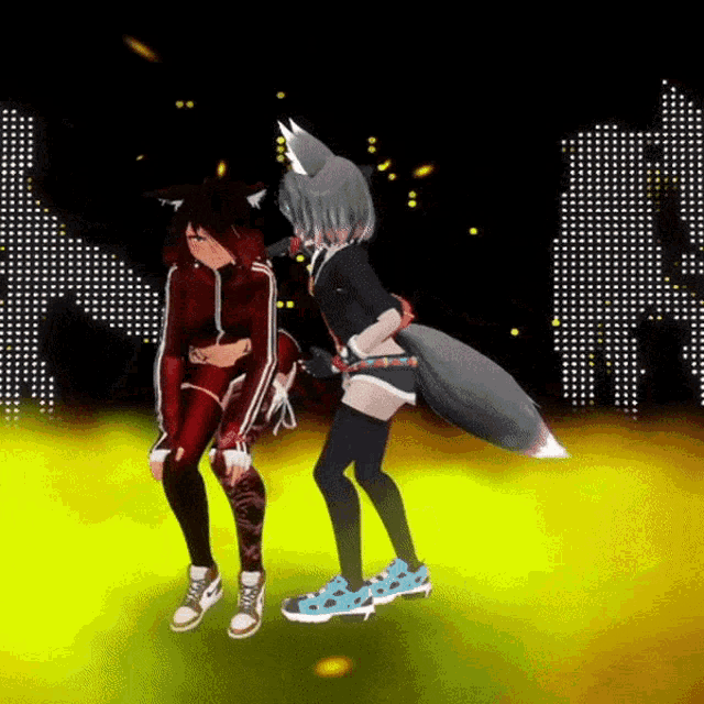 two anime girls are dancing on a stage and one has a fox tail