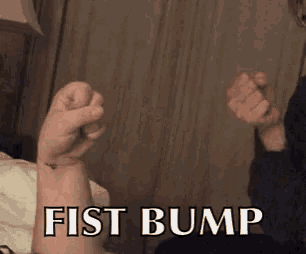 a fist bump is being displayed on a person 's arm