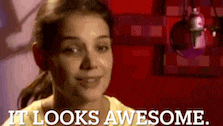 a woman says it looks awesome in front of a red background